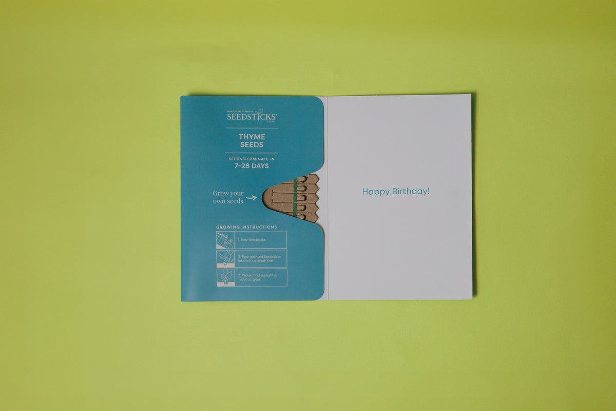 Happy Birthday Seedsticks greeting card opened to show thyme seeds and planting instructions