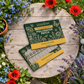 Pollinator Patch Seedsticks pack opened on a garden table among pollinator-friendly flowers