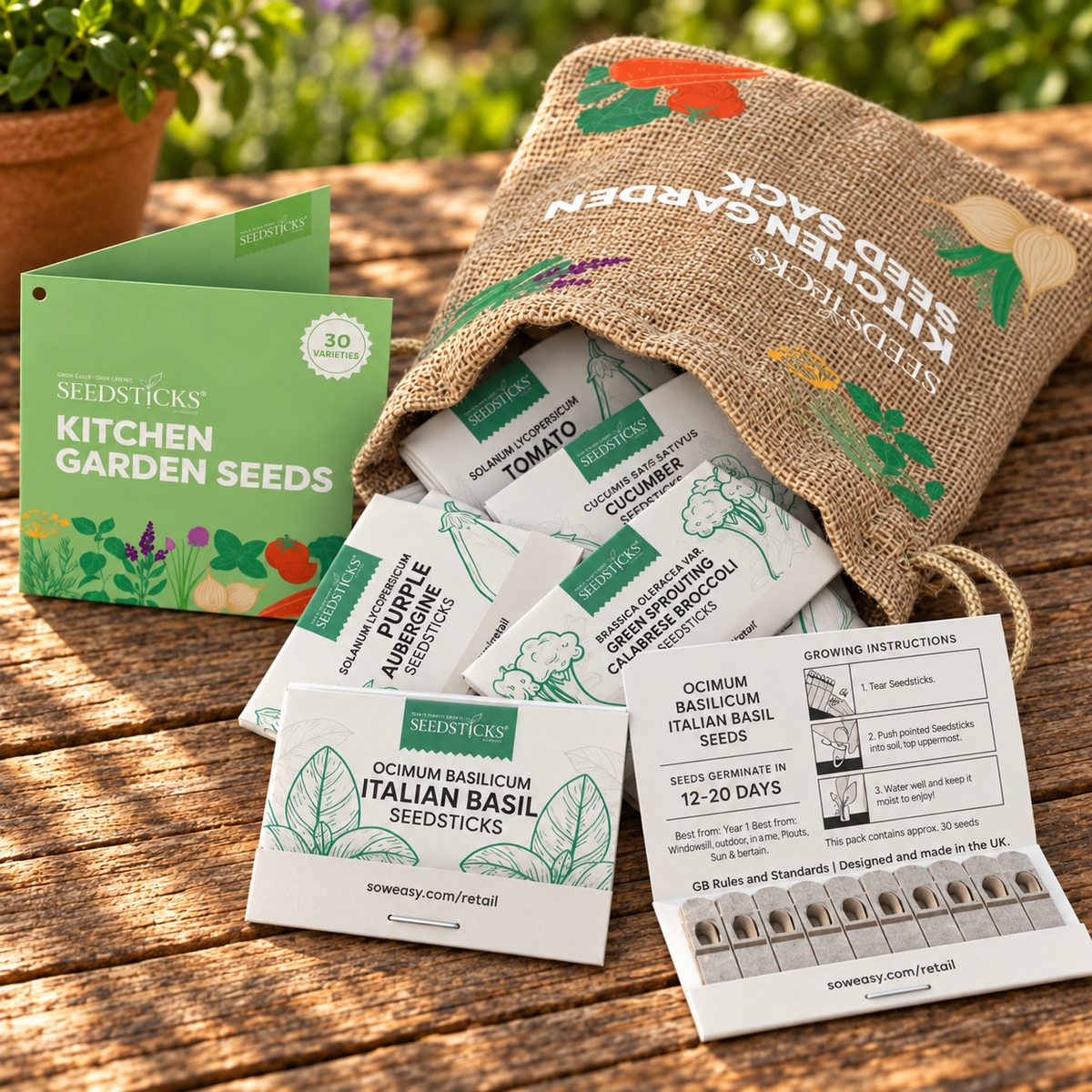 Kitchen Garden Seed Sacks with vegetable and herb Seedsticks laid out in a garden setting