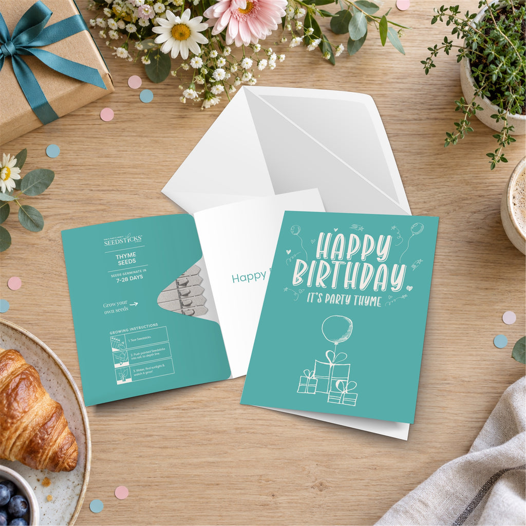Happy Birthday Greeting Card Seedsticks with card, envelope and planting gift in a celebration setting