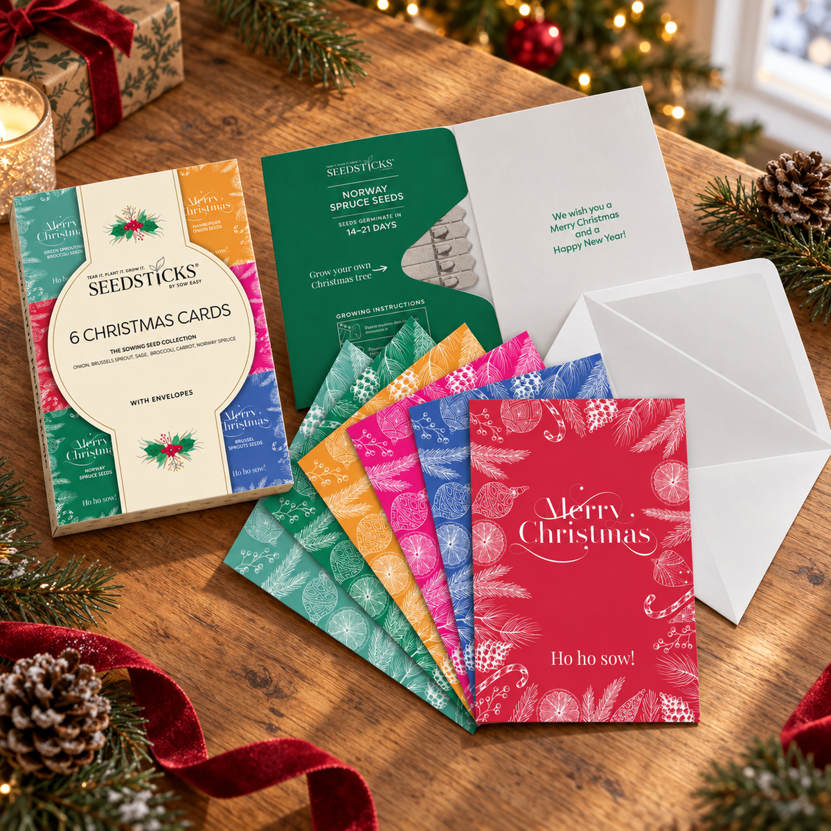Christmas Greeting Card Seedsticks Set with cards, envelopes and planting gifts in a festive setting